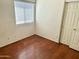 A bedroom featuring neutral walls, hard flooring and a closet at 592 E 9Th Ave, Apache Junction, AZ 85119