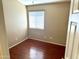 Cozy bedroom featuring wood flooring and a bright window for natural light at 592 E 9Th Ave, Apache Junction, AZ 85119