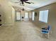 Spacious living room with carpeted floors and an abundance of windows for natural light at 592 E 9Th Ave, Apache Junction, AZ 85119