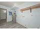Utility room with water heater and shelving with gray wood-look flooring at 6025 W Marconi Ave, Glendale, AZ 85306