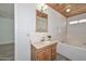This bathroom features a wood-paneled ceiling, tub, vanity, and medicine cabinet at 6025 W Marconi Ave, Glendale, AZ 85306