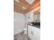 Bathroom featuring a vessel sink on a granite counter with modern wood-look ceilings at 6025 W Marconi Ave, Glendale, AZ 85306