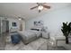 Cozy bedroom with neutral tones, decorative art, and a comfortable seating area at 6025 W Marconi Ave, Glendale, AZ 85306