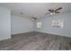 Expansive bonus room featuring a light, airy feel, wood flooring, and multiple windows at 6025 W Marconi Ave, Glendale, AZ 85306