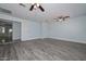 Large bonus room with neutral walls and wood-look floors is ready for your personal touch! at 6025 W Marconi Ave, Glendale, AZ 85306