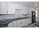 Updated kitchen featuring white cabinets, granite countertops and stainless steel appliances at 6025 W Marconi Ave, Glendale, AZ 85306
