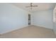 Spacious living room with neutral walls and ceiling fan; perfect for entertaining at 6025 W Marconi Ave, Glendale, AZ 85306