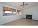 Inviting living room with fireplace and large windows overlooking the covered patio at 6025 W Marconi Ave, Glendale, AZ 85306