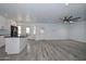 Spacious layout featuring a kitchen island with granite countertop and wood flooring at 6025 W Marconi Ave, Glendale, AZ 85306
