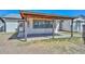 Covered patio featuring exposed rafters, a concrete floor, and views of the backyard at 6025 W Marconi Ave, Glendale, AZ 85306