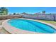 Backyard with a fenced pool surrounded by concrete decking at 6025 W Marconi Ave, Glendale, AZ 85306