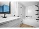 Updated bathroom with a modern vanity, stylish fixtures, and a shower-tub combination at 6201 W Acoma Dr, Glendale, AZ 85306
