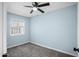 Bedroom featuring neutral paint, a ceiling fan, and plush carpet at 6201 W Acoma Dr, Glendale, AZ 85306