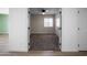 Carpeted bedroom with ceiling fan, neutral paint, and natural light at 6201 W Acoma Dr, Glendale, AZ 85306