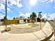 A well-kept property sits on a corner lot with gravel landscaping and block wall at 6201 W Acoma Dr, Glendale, AZ 85306