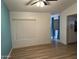 Open floor plan with blue accent wall and light vinyl floors at 6201 W Acoma Dr, Glendale, AZ 85306