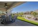 This large covered patio is perfect for outdoor relaxation and features a ceiling fan and desert landscaping at 6334 E Viewmont Dr # 29, Mesa, AZ 85215