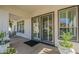The covered patio with tile flooring features access to the home through large sliding glass doors at 6334 E Viewmont Dr # 29, Mesa, AZ 85215