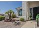 Close up of the front door and garden area in xeriscaped yard with desert foliage at 6334 E Viewmont Dr # 29, Mesa, AZ 85215