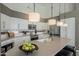 Contemporary kitchen with a large island, stylish lighting, and modern stainless appliances at 6334 E Viewmont Dr # 29, Mesa, AZ 85215