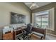 Comfortable office features a ceiling fan, nice desk, and view of the lush outdoors at 6334 E Viewmont Dr # 29, Mesa, AZ 85215