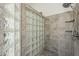 Shower stall featuring beautiful tile work, glass blocks, and rainfall shower head at 6334 E Viewmont Dr # 29, Mesa, AZ 85215