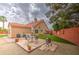 Spacious backyard with a patio, dining area, and a built-in BBQ grill at 657 N Marble St, Gilbert, AZ 85234