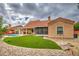 Beautiful backyard with a pool, artificial turf, and a covered patio, perfect for entertaining at 657 N Marble St, Gilbert, AZ 85234