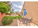 Backyard featuring an outdoor dining area and lush landscaping at 657 N Marble St, Gilbert, AZ 85234