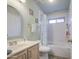 Bright bathroom featuring a shower-tub combo and a light wood vanity at 657 N Marble St, Gilbert, AZ 85234
