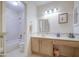 Traditional bathroom features a tiled shower-tub combo and an extended vanity at 657 N Marble St, Gilbert, AZ 85234