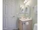 Charming bathroom features a white vanity with a mirror and ample lighting at 657 N Marble St, Gilbert, AZ 85234