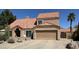 Charming two-story home with a tile roof, attached garage, desert landscaping, and inviting curb appeal at 657 N Marble St, Gilbert, AZ 85234
