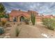 Charming two-story home featuring a Spanish tile roof and a two-car garage with inviting front patio at 657 N Marble St, Gilbert, AZ 85234