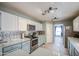 Charming kitchen features stainless steel appliances and granite countertops at 657 N Marble St, Gilbert, AZ 85234