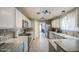 Charming kitchen features stainless steel appliances and granite countertops at 657 N Marble St, Gilbert, AZ 85234