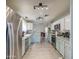 Well-lit kitchen featuring stainless steel appliances and light blue cabinets at 657 N Marble St, Gilbert, AZ 85234
