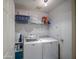 Functional laundry room with modern washer and dryer, plus ample storage space at 657 N Marble St, Gilbert, AZ 85234