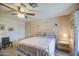 Spacious main bedroom with a ceiling fan and ensuite bath at 657 N Marble St, Gilbert, AZ 85234