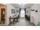 Bright office with two desks, a window with blue curtains, and neutral tile flooring at 657 N Marble St, Gilbert, AZ 85234