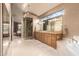 Bathroom boasting a large window, walk-in shower, double vanities, and soaking tub at 7380 E Turquoise Ave, Scottsdale, AZ 85258