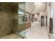 Luxurious bathroom featuring a walk-in shower, soaking tub, and double vanities at 7380 E Turquoise Ave, Scottsdale, AZ 85258