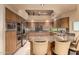 Well-equipped kitchen featuring stainless steel appliances, granite countertops, and custom cabinetry at 7380 E Turquoise Ave, Scottsdale, AZ 85258