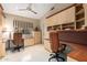 Home office with built-in desks, shelving, and ample storage space at 7380 E Turquoise Ave, Scottsdale, AZ 85258