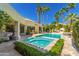 Inviting pool and spa area surrounded by lush landscaping and tall palm trees at 7380 E Turquoise Ave, Scottsdale, AZ 85258