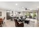 Open-concept living room with modern finishes, adjacent to an island kitchen at 7642 E Pasadena Ave, Scottsdale, AZ 85250