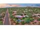 Bird's-eye view of a luxury home, in a serene desert setting with a backyard pool at 8003 E Sands Dr, Scottsdale, AZ 85255