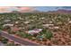 Aerial view of a single-Gathering home with a swimming pool in a desert landscape at 8003 E Sands Dr, Scottsdale, AZ 85255