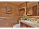 Elegant powder room with granite counters and stylish fixtures and décor at 8003 E Sands Dr, Scottsdale, AZ 85255