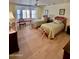 Traditional bedroom with two twin beds, natural light from the bay window, and hardwood floors at 8003 E Sands Dr, Scottsdale, AZ 85255